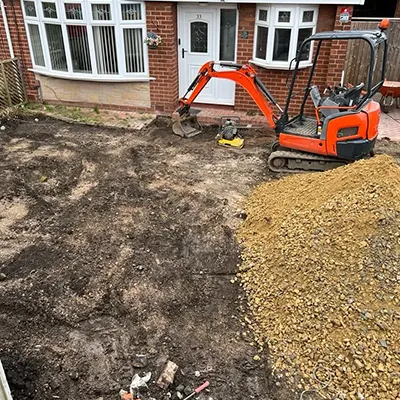 red digger outside house