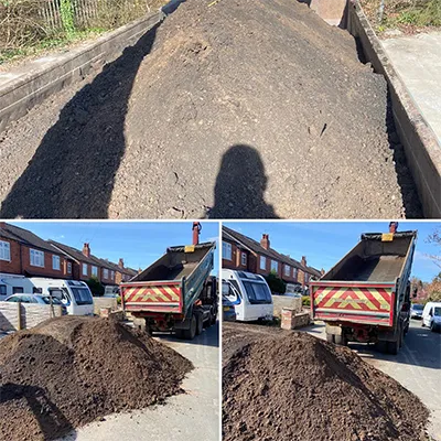 a dump truck filled with dirt in a parking lot