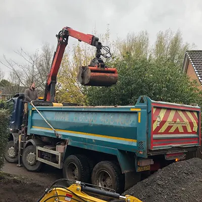 a dump truck with a crane on top of it